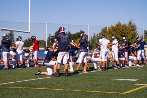Female football players kick off the season