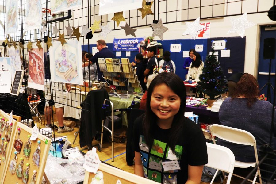 Alumna Grace Ling poses with her booth,
showcasing her work on sale.
