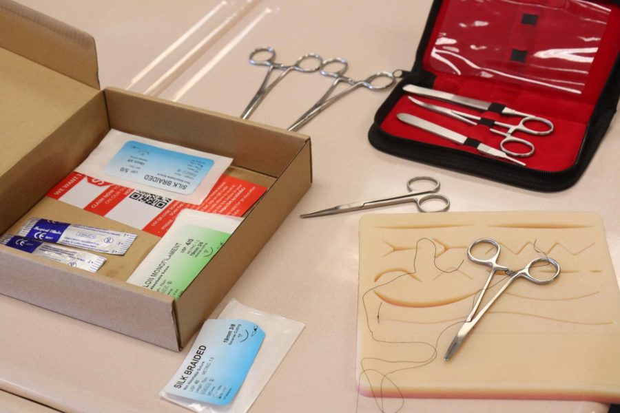 This box contains all the materials needed to practice suturing, in which surgeons carefully sew up a wound.
