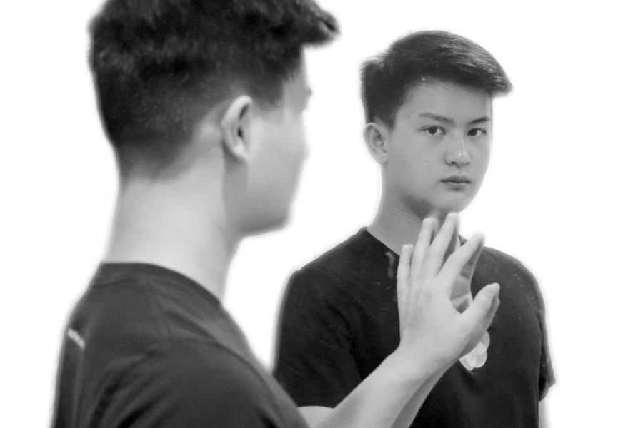 The writer, Bennie Chang, staring into the mirror and pondering over the truth about racism.