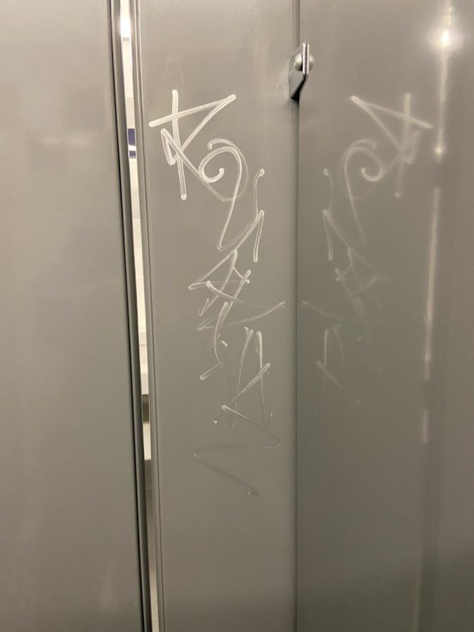 Graffiti found inside a bathroom stall. Used with permission from Edgar Duenas.