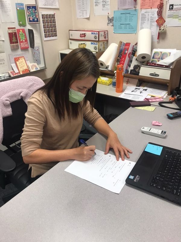 Chen takes Japanese test, a return to her college days.