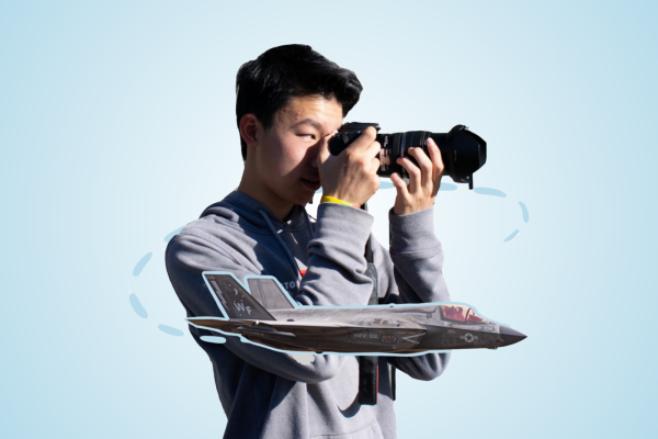 Sophomore Ethan Wong strategically positions himself before clicking his camera to capture the Lockheed Martin F-35C as it flies by.