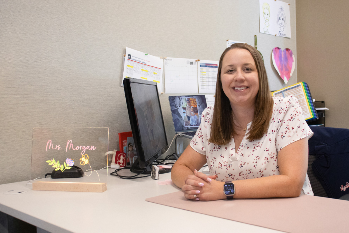 Assistant Principal Kimberlee Morgan is seated at her desk in the office. She takes on the responsibilities of counseling and student services.
